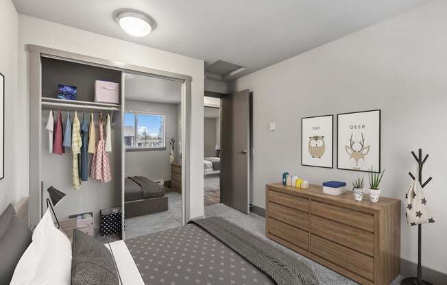 A bedroom with a bed, dresser, and a mirror.