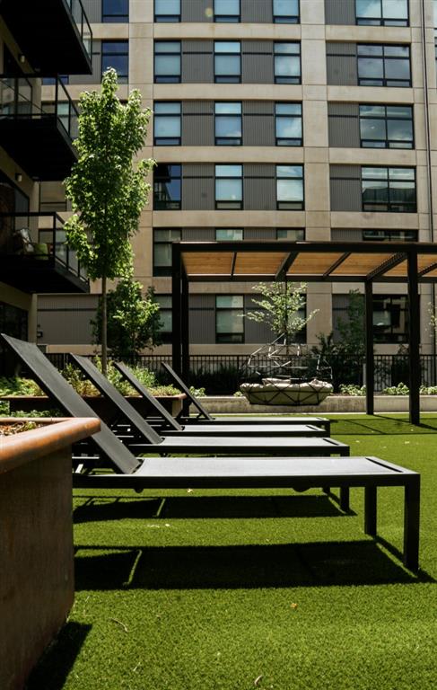 Outdoor courtyard with lounge chairs for sunbathing