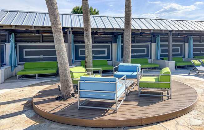 a circle of chairs and tables on a patio