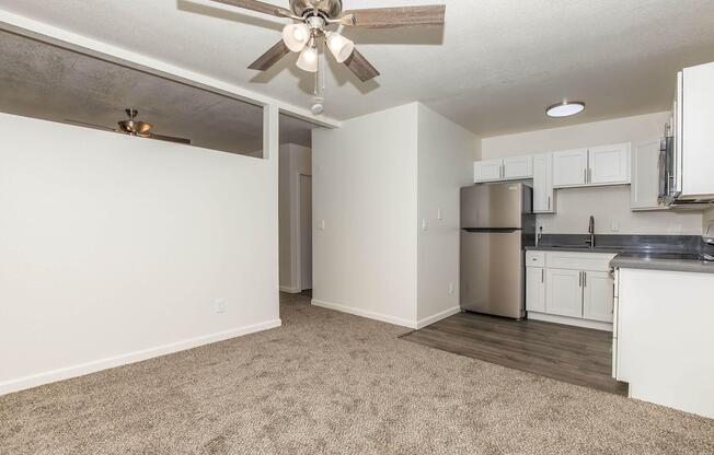 a kitchen with a sink and a refrigerator