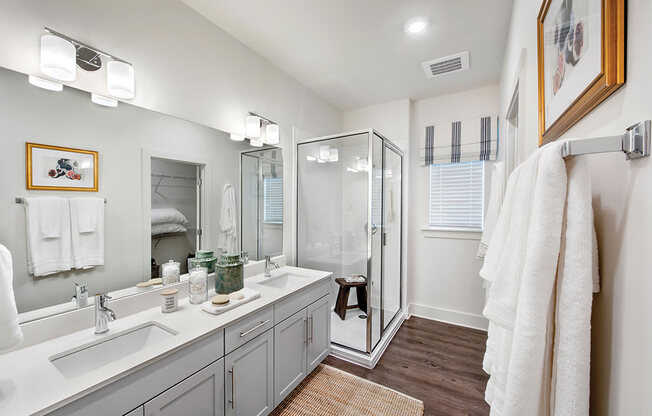 Bathroom with glass shower at the cottages