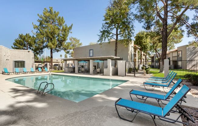 our apartments have a resort style swimming pool with blue benches