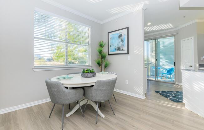 a living room filled with furniture and a large window