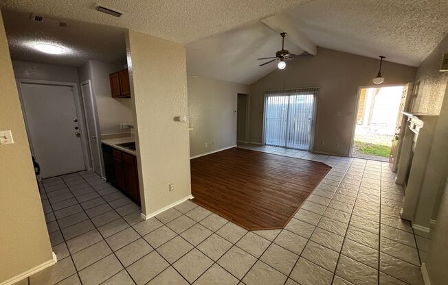 Open Concept, Wood burning fireplace with Ceramic Flooring