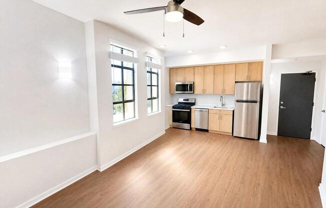 Redesigned kitchen with new cabinetry, upgraded stainless steel appliances, and a built-in dishwasher.