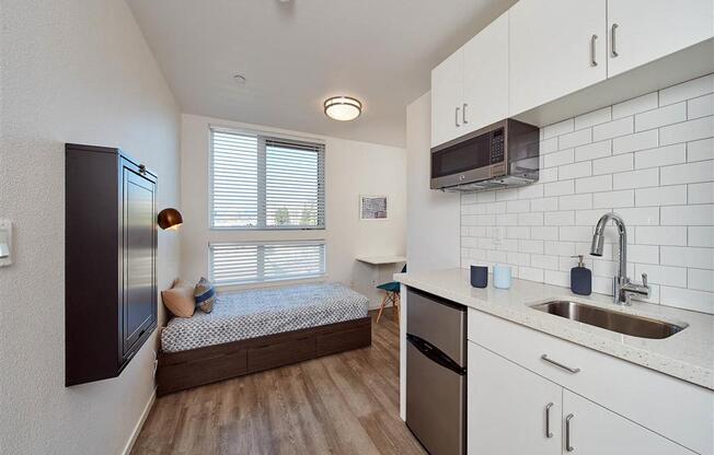a kitchen with a sink next to a window