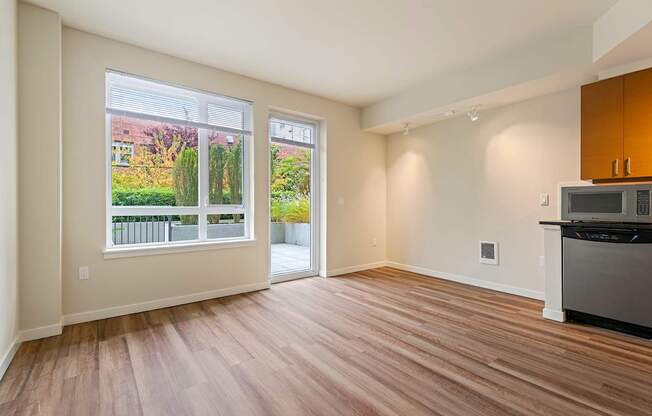 A kitchen area with a dishwasher and a microwave.