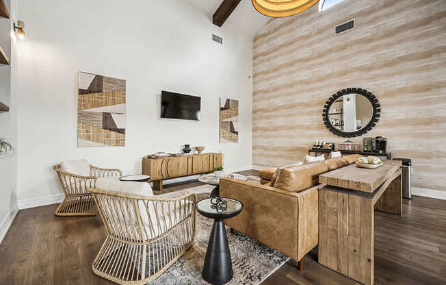 A living room with a brown couch and a woven chair.