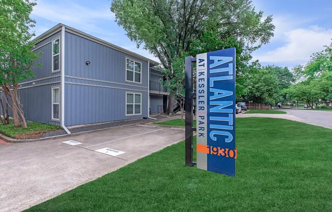 a sign in front of a house