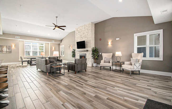 Community building with tv and fireplace at Strathmore Apartment Homes, Iowa