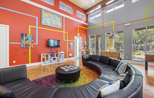 Resident Clubhouse with Sofa at Artisan Apartments & Shops, Austin, Texas