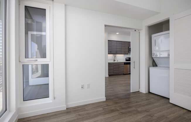 a view of a kitchen and a living room from a window