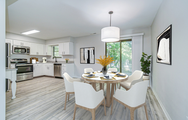 Platinum dining room set, kitchen and glass patio door at The Arbor in Blue Springs, Missouri