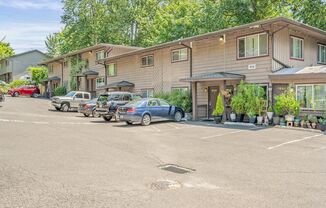 Spacious 2-Bedroom Condo with Forest Views, Private Balcony, In-Unit Laundry & Community Amenities in SW Portland