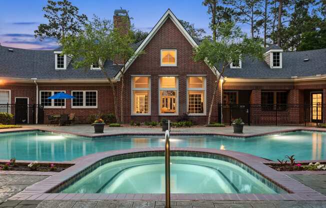 a house with a swimming pool in front of it at Villages of Cypress Creek, Houston, Texas