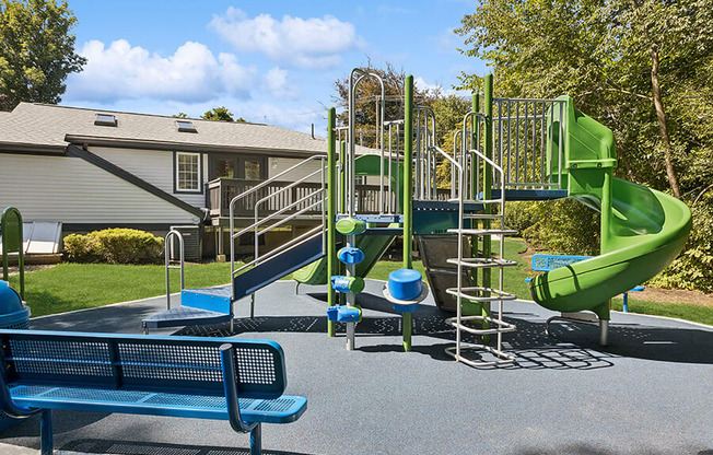 Community Playground with a Slide at Middlesex Crossing Apartments located in Billerica, MA.