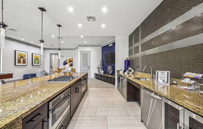 Fully equipped catering kitchen with modern appliances and stylish finishes at Allusion at West University apartments in Houston, TX