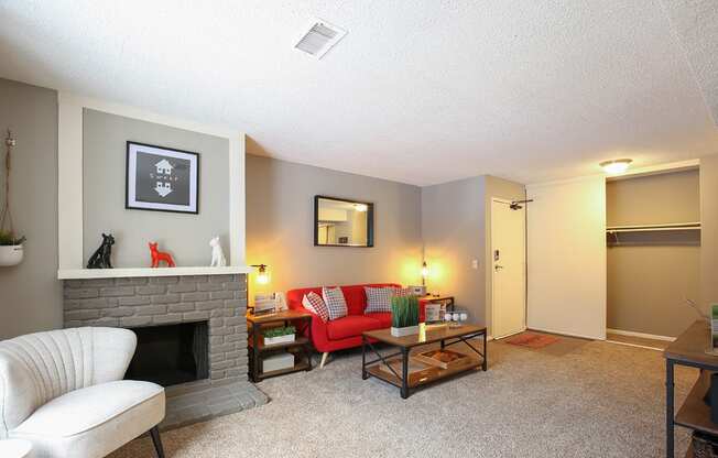 a living room with a couch and a fireplace