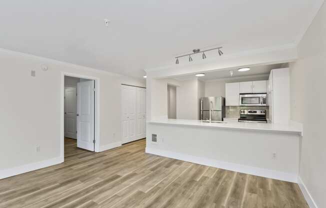 a kitchen and living room in a 555 waverly unit