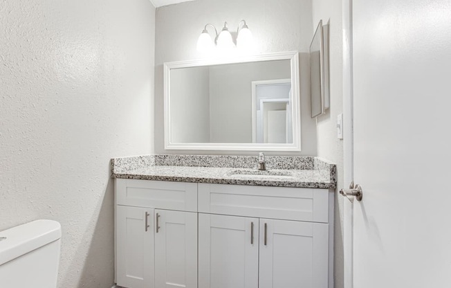 a bathroom with a sink and a mirror  at Barcelo at East Cobb, Marietta, Georgia