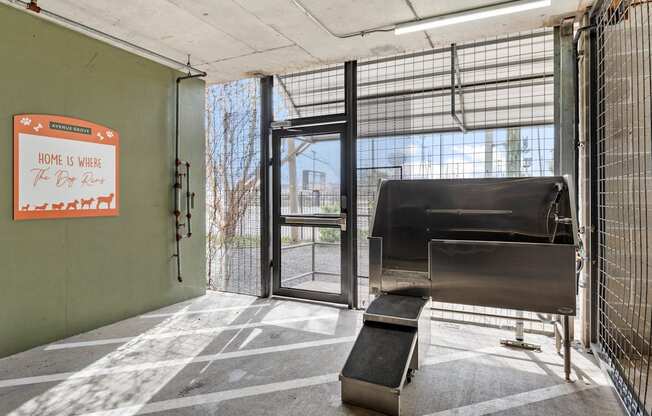 the lobby of a building with a piano and a door