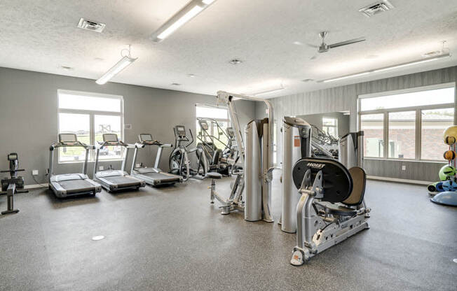 Nice fitness center with treadmills and weightlifting machines at The Villas at Falling Waters in west Omaha NE