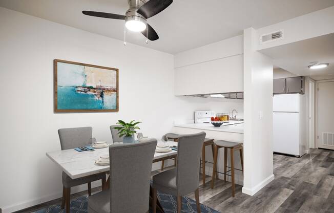 a dining room and kitchen with a table and chairs