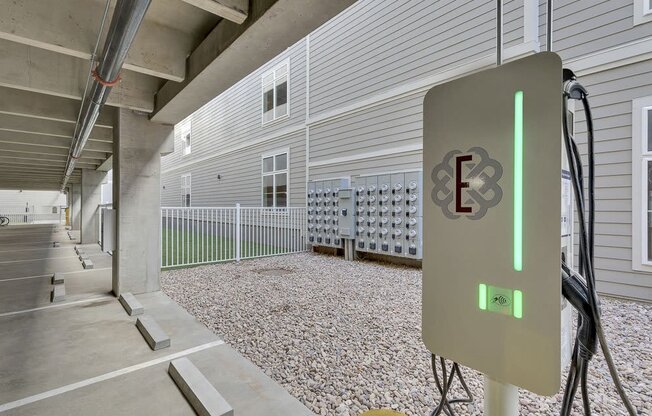 A parking garage with a charging station for electric vehicles.