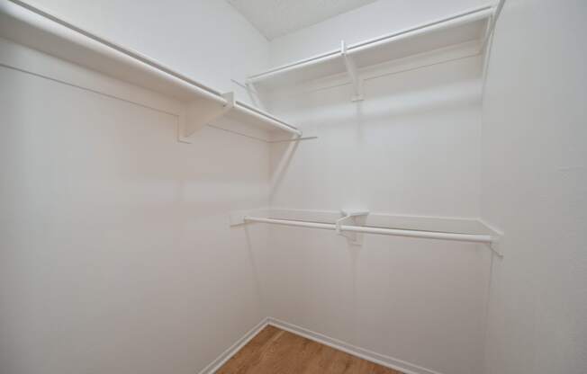 the preserve at ballantyne commons empty walk in closet with white walls and shelves