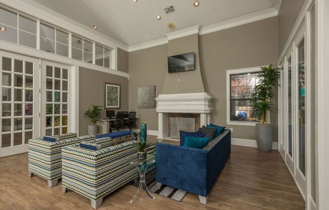 a living room with couches and a fireplace