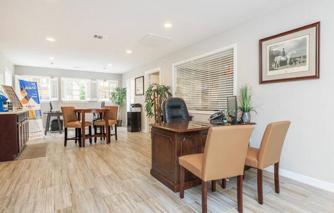 a living room filled with furniture and a wood floor