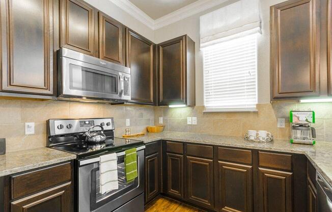 Kitchen With Ample Storage at Berkshire Woodland, Conroe