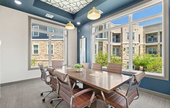 A conference room with a long table and chairs.