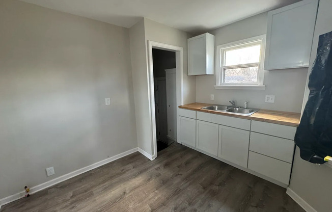 2 bed 1 bath recently refinished corner home with new kitchen, bathroom, and floors!
