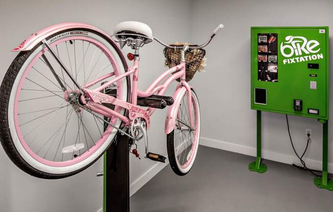 a bike parked on top of a black pole