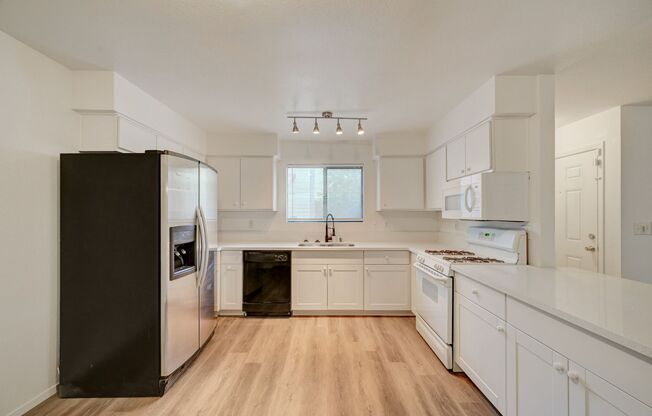 Welcome to this beautifully remodeled ground-floor residence, ideally situated near Charleston and Rainbow.