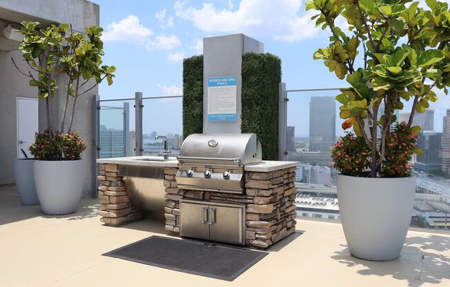 Grill out with endless city views on top of our Sky Deck rooftop amenity.