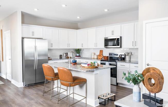 Gourmet kitchens with granite countertops offer a stylish and functional space for cooking and entertaining. Amenity image tile: Gourmet kitchens with quartz countertops