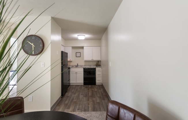 This is a photo of the kitchen from the dining area in a 560 square foot, 1 bedroom, 1 bath apartment at Aspen Village Apartments in Cincinnati, OH.