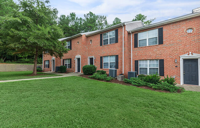 Brick exterior townhomes at Greens of Pine Glen in Durham NC
