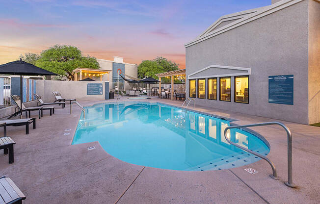 Community Swimming Pool with Pool Furniture at Ridgeline Apartments in Tucson, AZ.