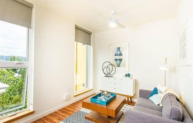 Living Room With Expansive Window at Lower Burnside Lofts, Portland