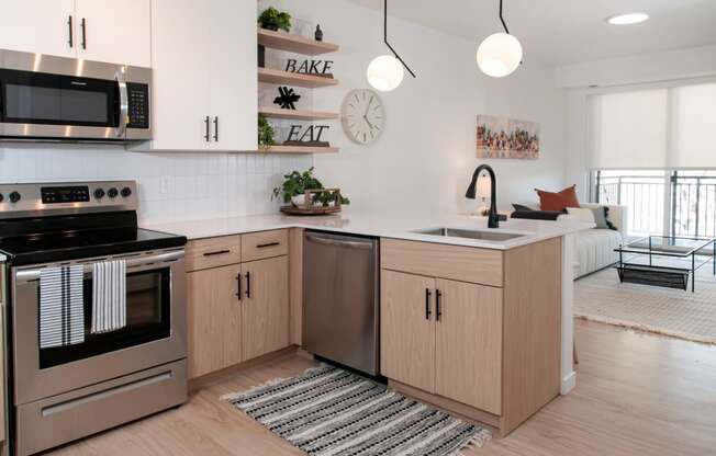 Fully Equipped Kitchen Includes Frost-Free Refrigerator, Electric Range, & Dishwasher at CityLine Apartments, Minnesota, 55406