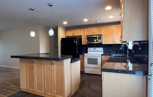 Well maintained 4 BD 1.75 BA Home with Genuine Hardwood Floors & Private Fully Fenced Backyard
