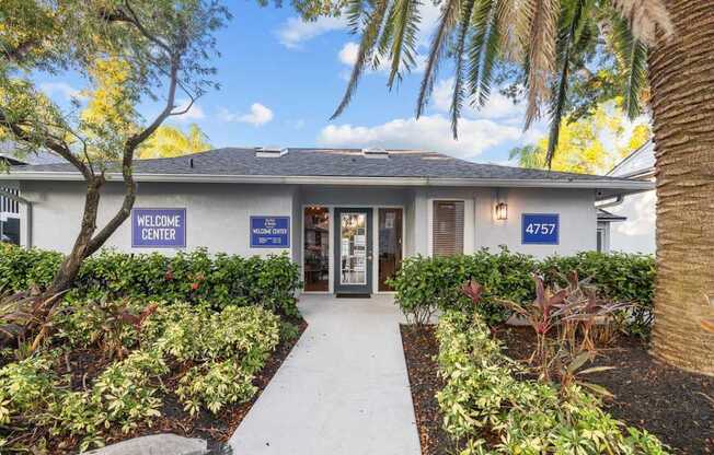 A building with a sign that says "Welcome Center" and a number "4751" on it.