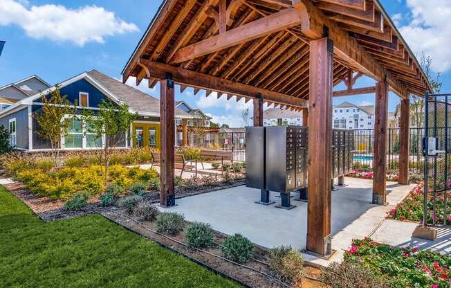 a gazebo with a hot tub in a garden