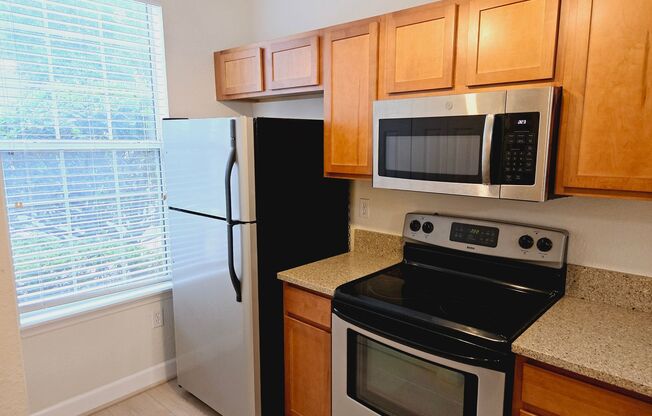 2BR/2.5BA furnished townhome in a gated community close to the University of Florida, Shands, Butler Plaza, and more!