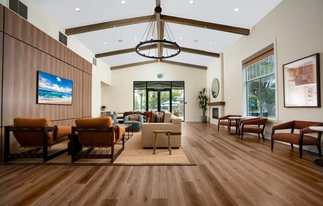 a large living room with furniture and a chandelier