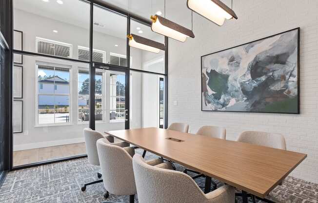 the spacious glassed in conference room with a large conference table and chairs in Sanctuary at Indian Creek Clubhouse