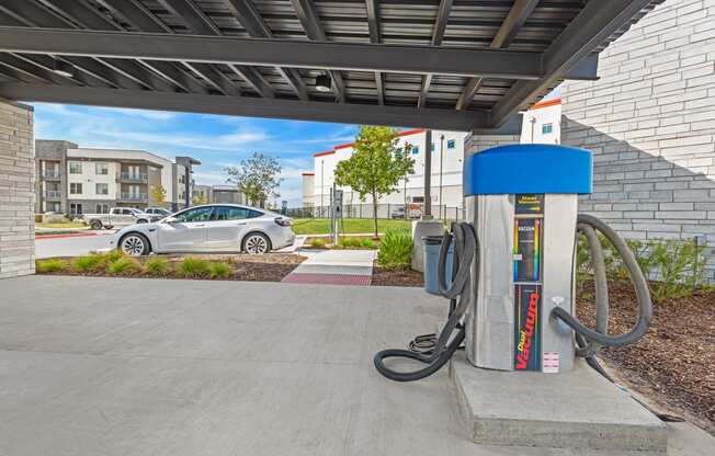 a gas station with a car in the background at Presidium Revelstoke, Fort Worth, 76131